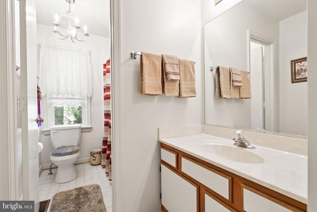 full bath with vanity, tile patterned flooring, baseboards, and toilet