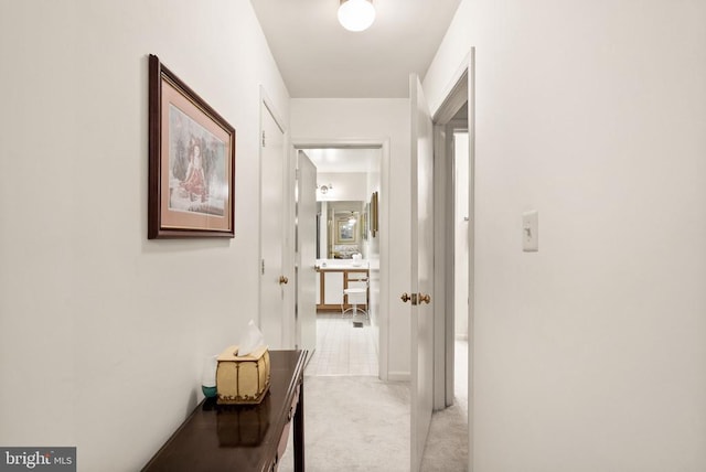 corridor with light carpet