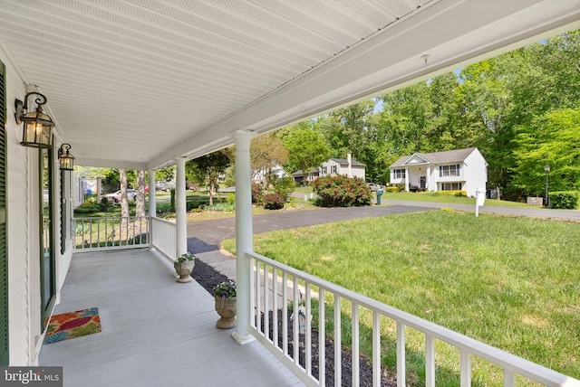 view of patio featuring a residential view and a porch