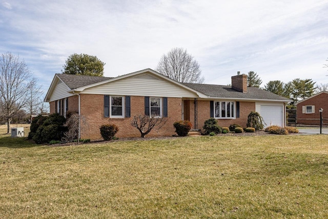 ranch-style house featuring brick siding, a front lawn, a chimney, and a garage