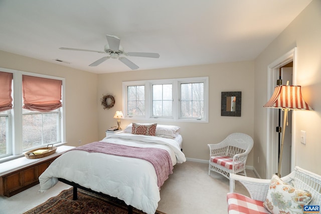 bedroom with light colored carpet and ceiling fan