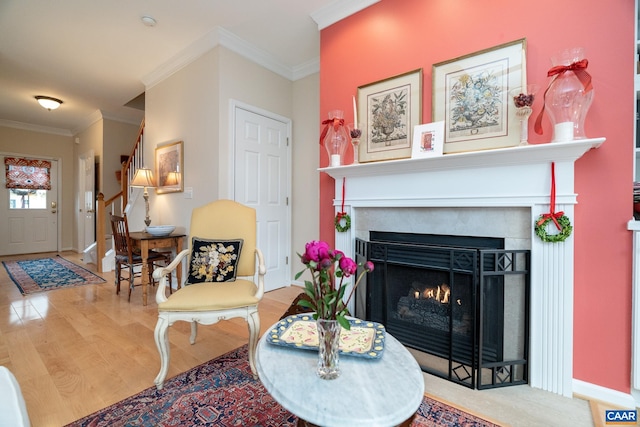 living room featuring hardwood / wood-style flooring and ornamental molding