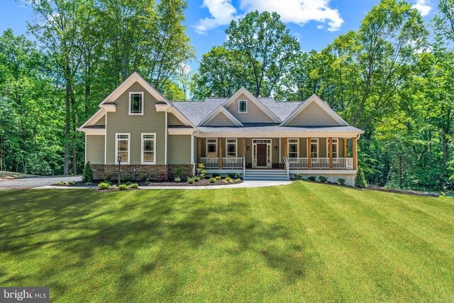 craftsman-style home with a porch and a front yard