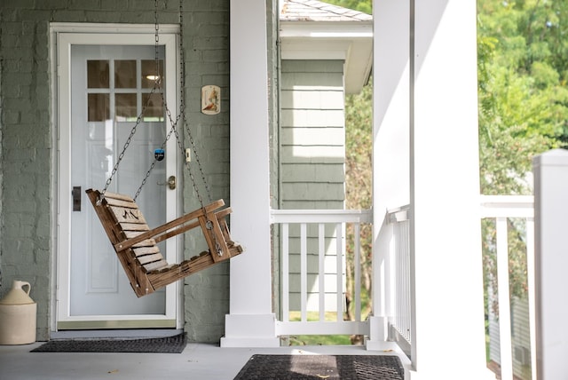 doorway to property featuring covered porch