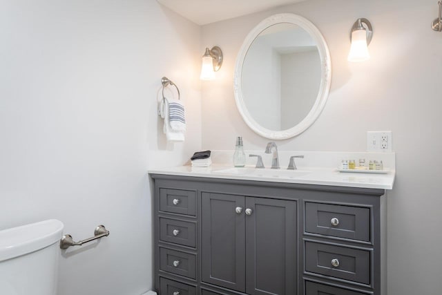 bathroom with toilet and vanity