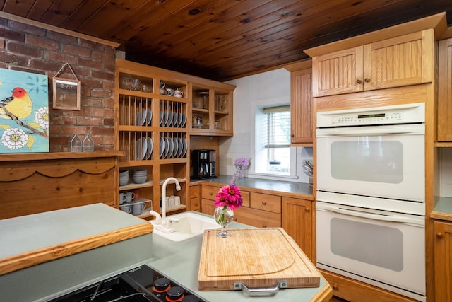 kitchen with a sink, open shelves, white double oven, and wooden ceiling