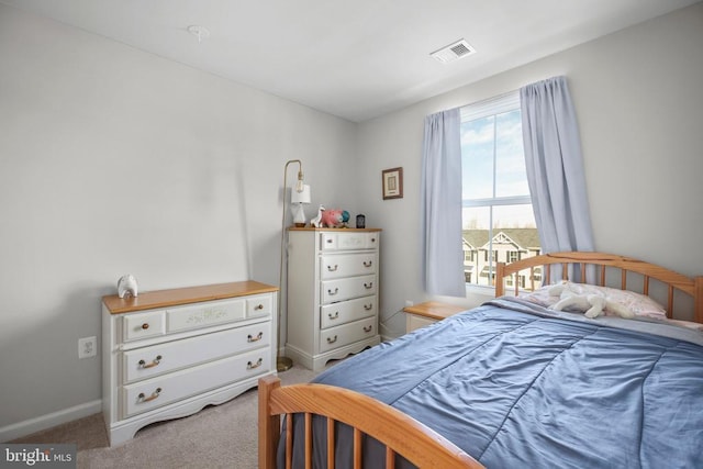 bedroom featuring light colored carpet