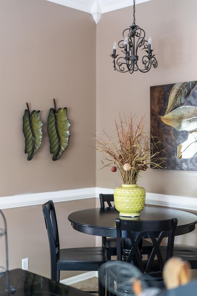 dining area featuring ornamental molding