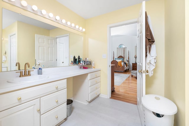 bathroom featuring vanity and wood-type flooring