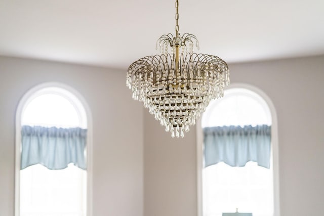 interior details featuring a notable chandelier