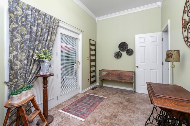 foyer with crown molding and light tile patterned flooring