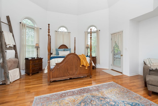 bedroom featuring hardwood / wood-style floors and access to exterior