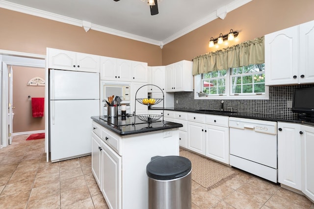 kitchen featuring white cabinetry, white appliances, crown molding, and a center island