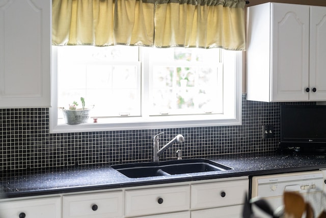 kitchen featuring white cabinetry, sink, decorative backsplash, and dishwasher