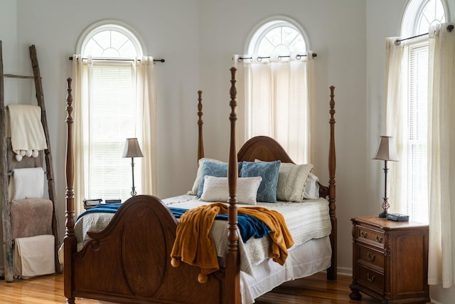 bedroom with hardwood / wood-style flooring