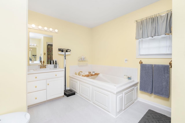 bathroom featuring vanity and a tub to relax in