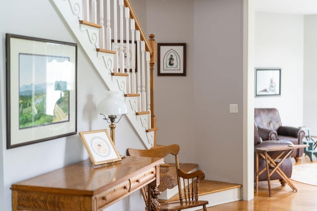 stairway with hardwood / wood-style flooring