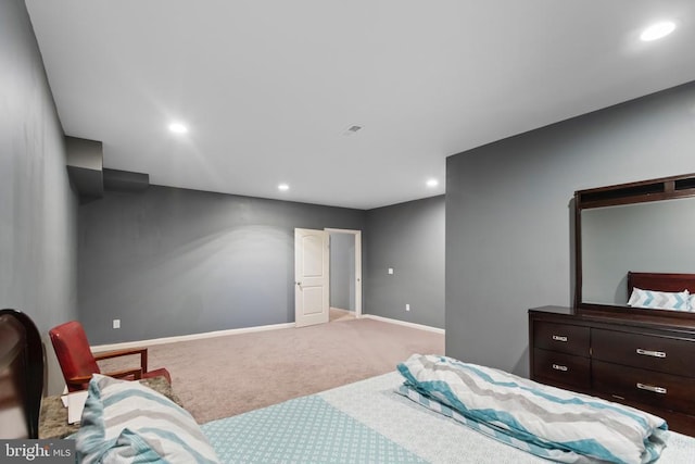 bedroom featuring recessed lighting, light colored carpet, and baseboards