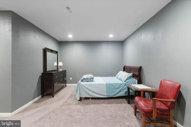 bedroom with light carpet, recessed lighting, visible vents, and baseboards