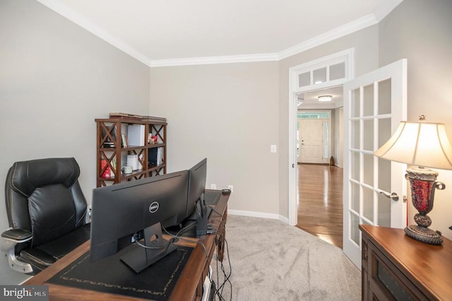 carpeted office with crown molding and french doors