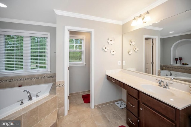 bathroom featuring crown molding, tile patterned floors, vanity, and tiled bath