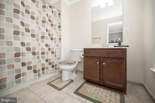 bathroom with vanity, crown molding, tile patterned floors, and toilet