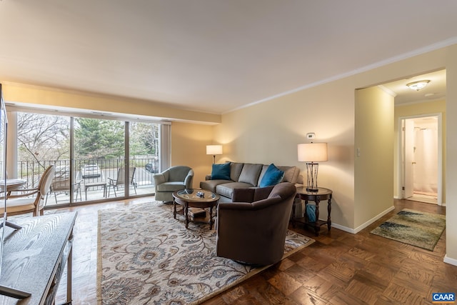 living room with crown molding and baseboards