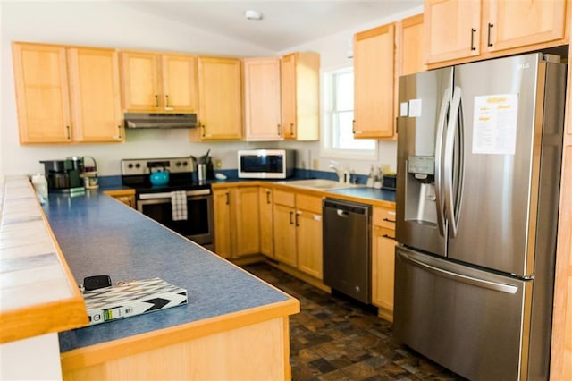 kitchen featuring a peninsula, stainless steel appliances, under cabinet range hood, light brown cabinets, and a sink