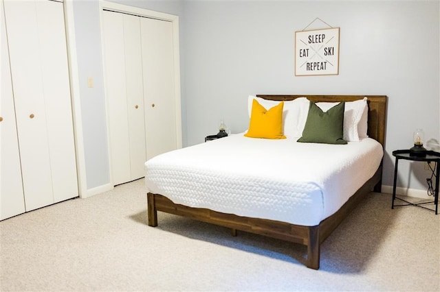 bedroom with carpet floors and baseboards