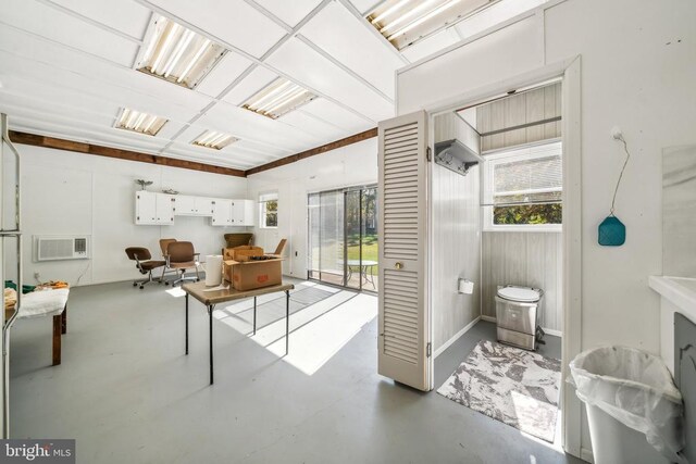 bathroom featuring concrete flooring and a wealth of natural light