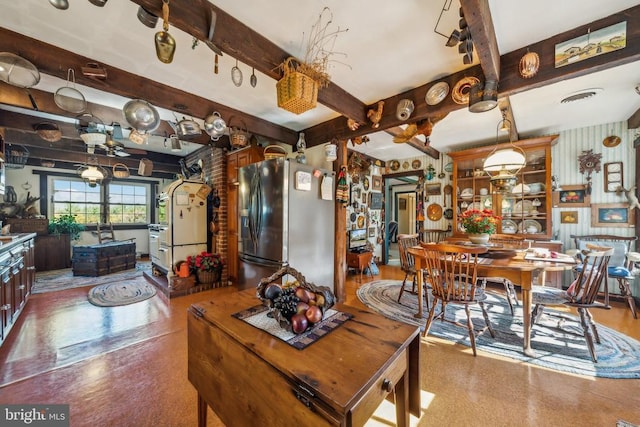 dining room with beamed ceiling