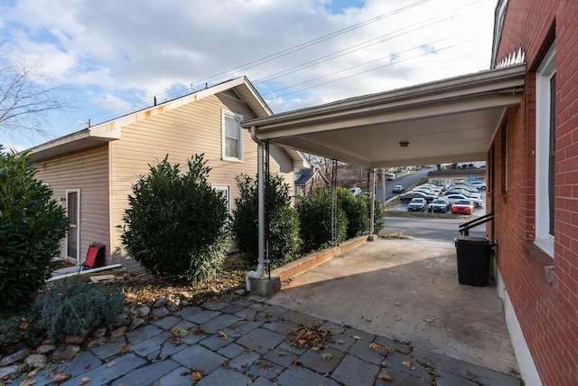 view of side of home featuring a carport