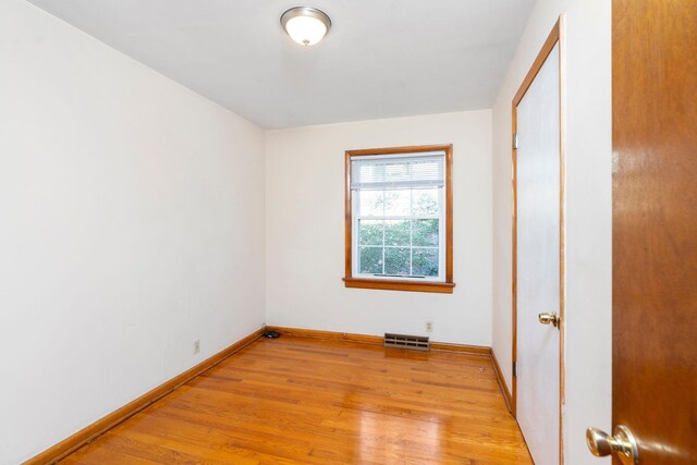 spare room with light wood-type flooring