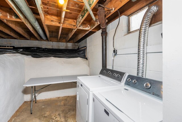 clothes washing area with independent washer and dryer