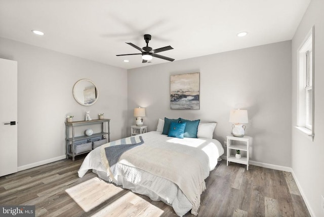 bedroom with recessed lighting, baseboards, wood finished floors, and a ceiling fan