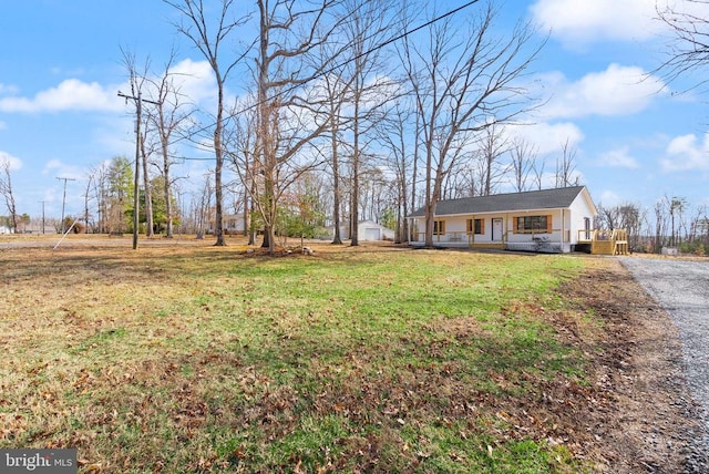 view of front of property with a front yard and covered porch