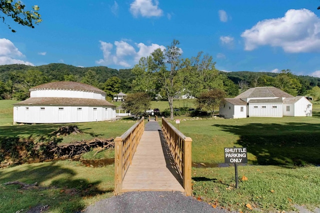 exterior space featuring a mountain view and a yard