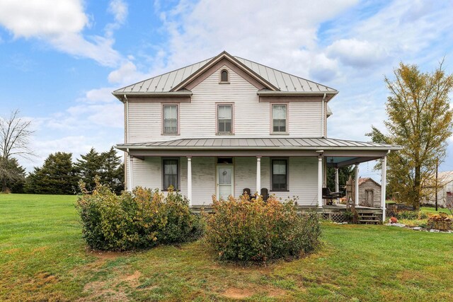 view of front of house with a front yard and a porch