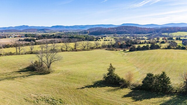 drone / aerial view with a mountain view and a rural view