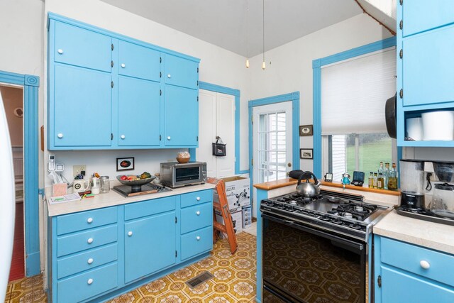 kitchen with black range with gas cooktop and blue cabinets