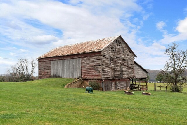 view of outbuilding with a lawn