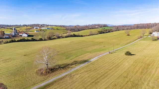 birds eye view of property with a rural view