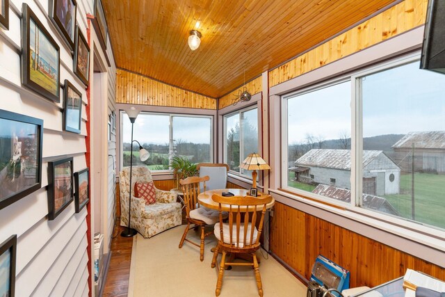 sunroom / solarium with wood ceiling and lofted ceiling