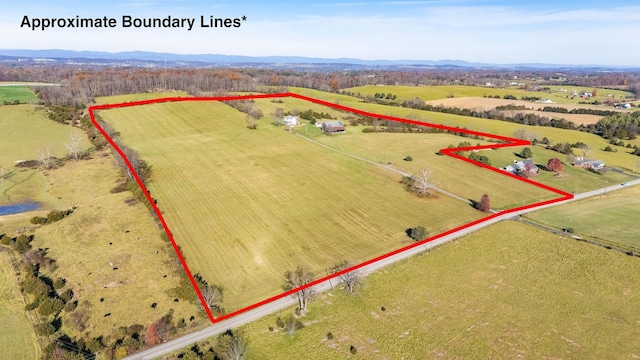 birds eye view of property featuring a rural view