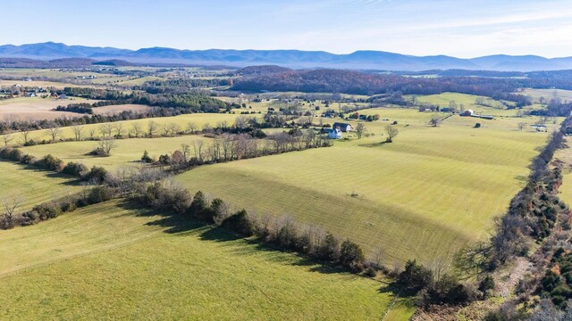 birds eye view of property with a mountain view and a rural view