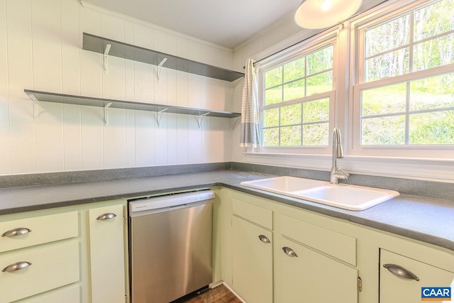 kitchen featuring open shelves, wood finished floors, dishwasher, a sink, and ornamental molding