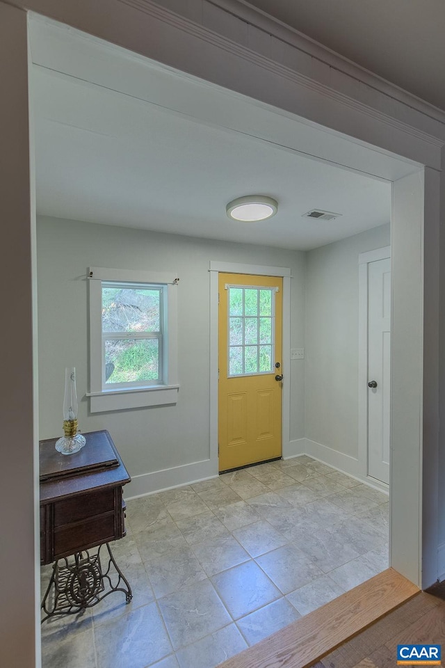 entryway featuring visible vents and baseboards