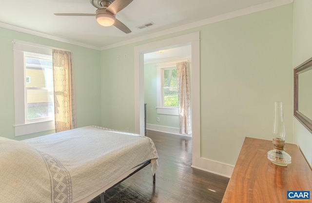 bedroom featuring baseboards, multiple windows, dark wood-style floors, and visible vents