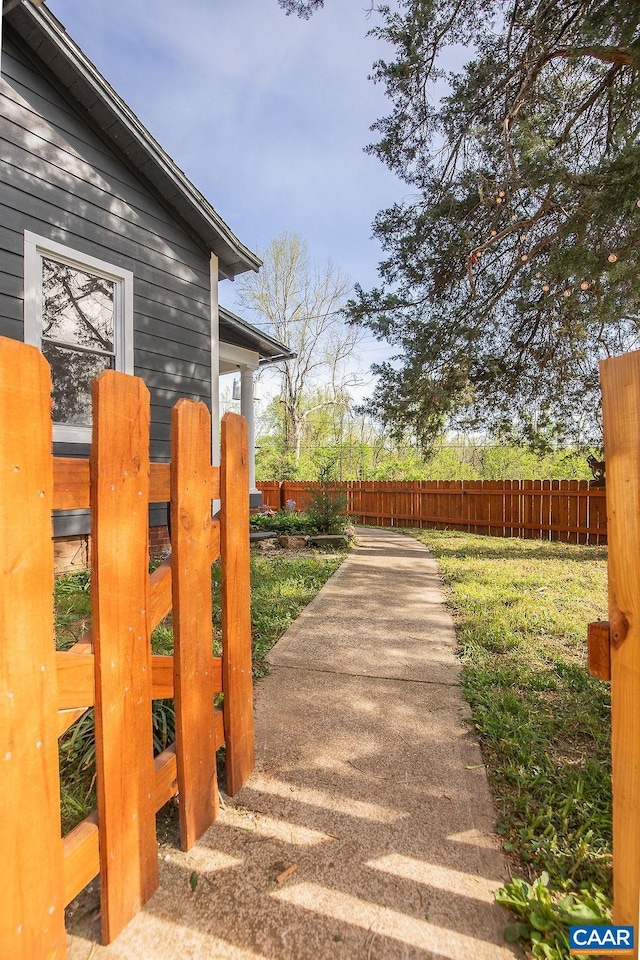 view of gate with fence