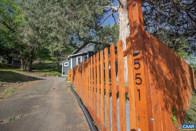 view of gate featuring fence